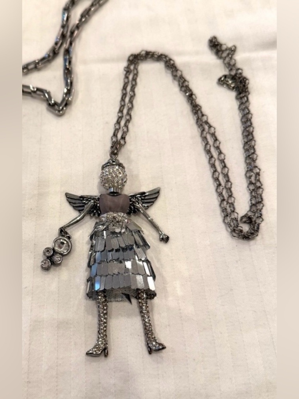 🟢 3/$20 - Silver and sparkly necklace with an angel pendant